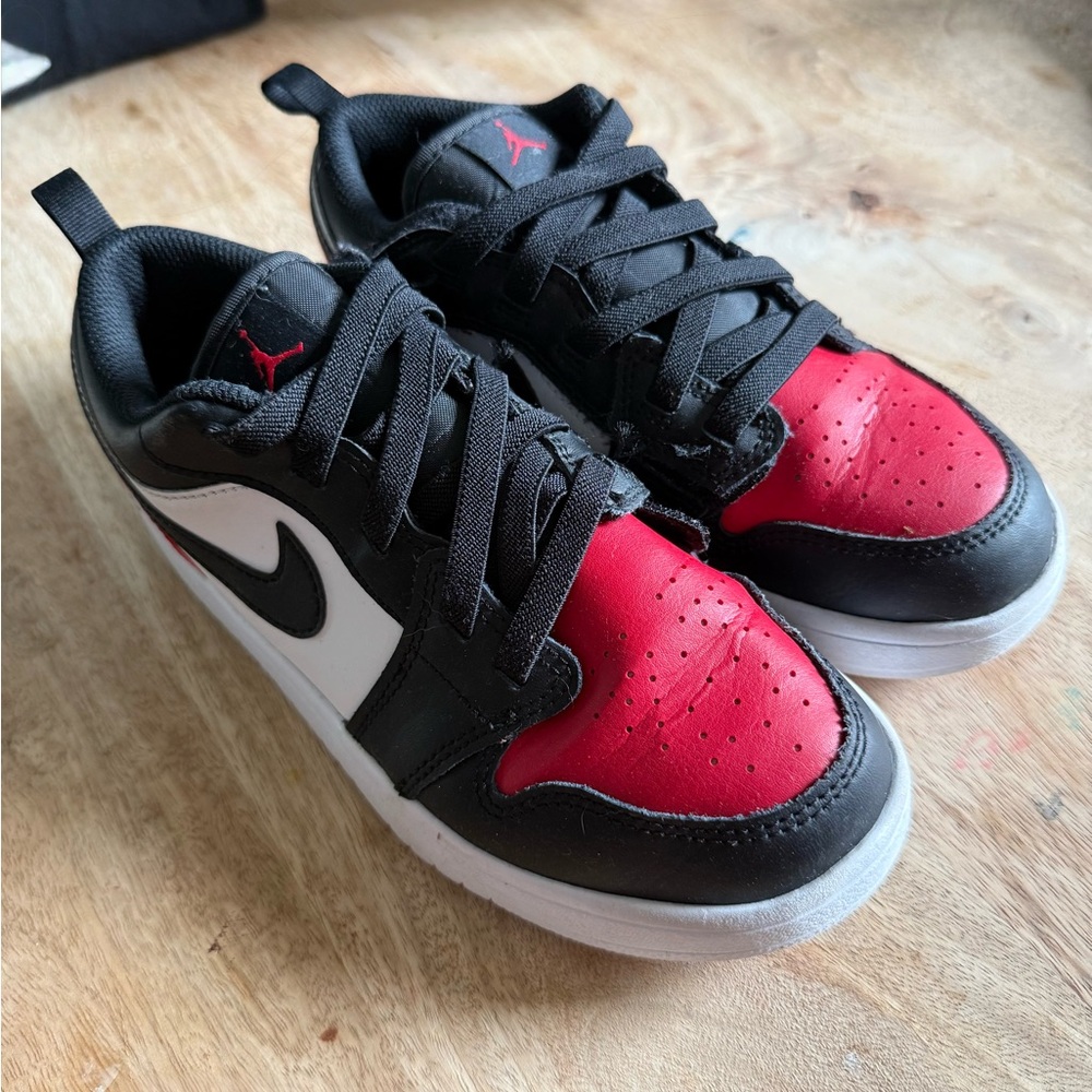 Jordan Air Jordan 1 Low SE. Boy’s size 3. Velcro closure for easy on/off.